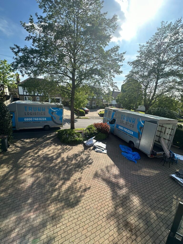 Two removals trucks at property with items prepared for unloading