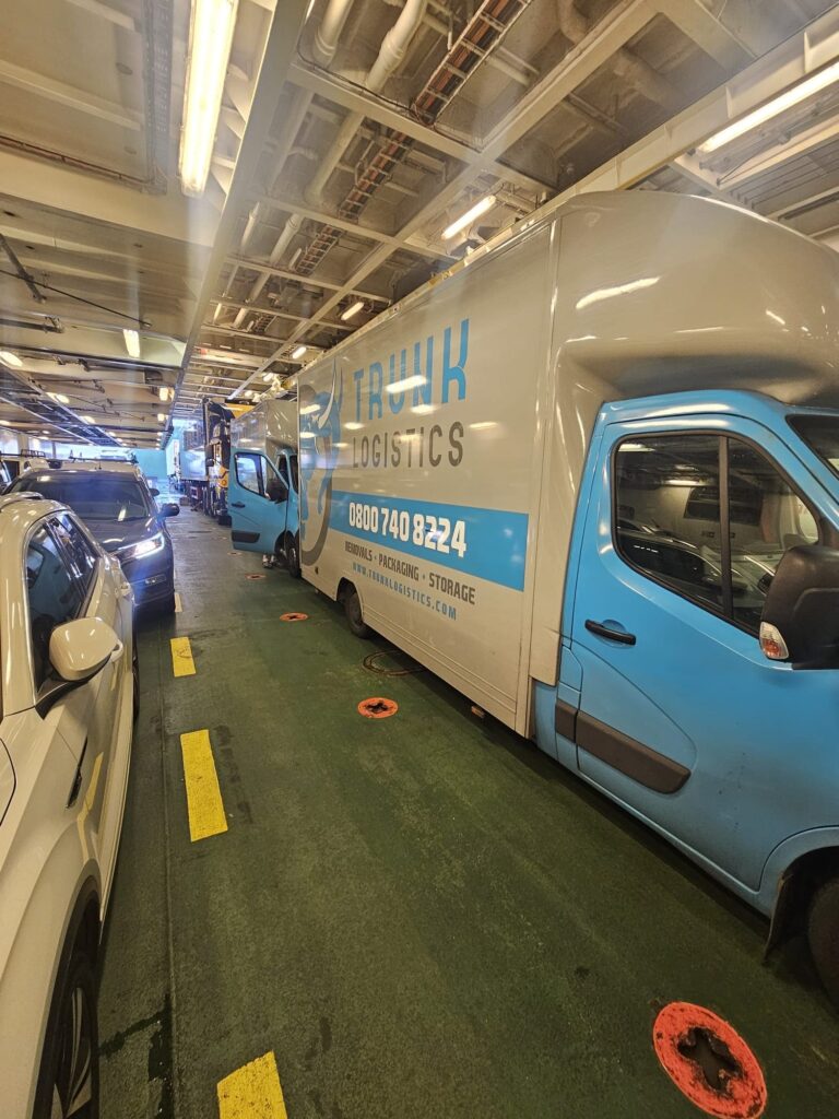 Removals truck on ferry transporting household goods across Europe