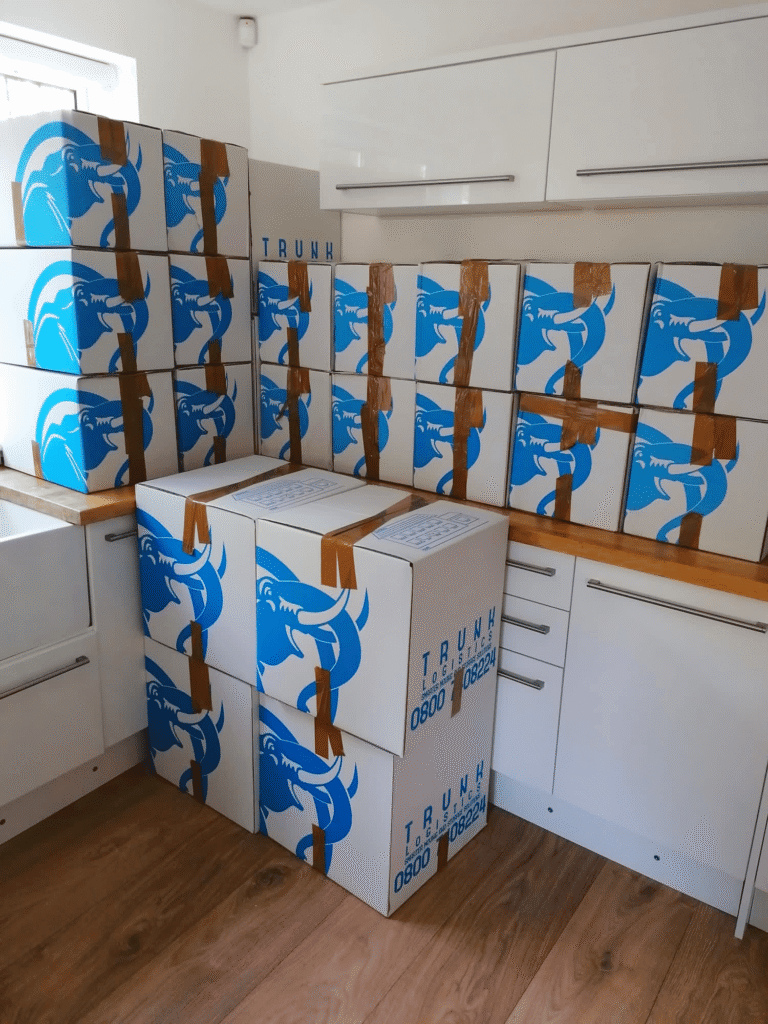 kitchen packed with moving boxes during house move