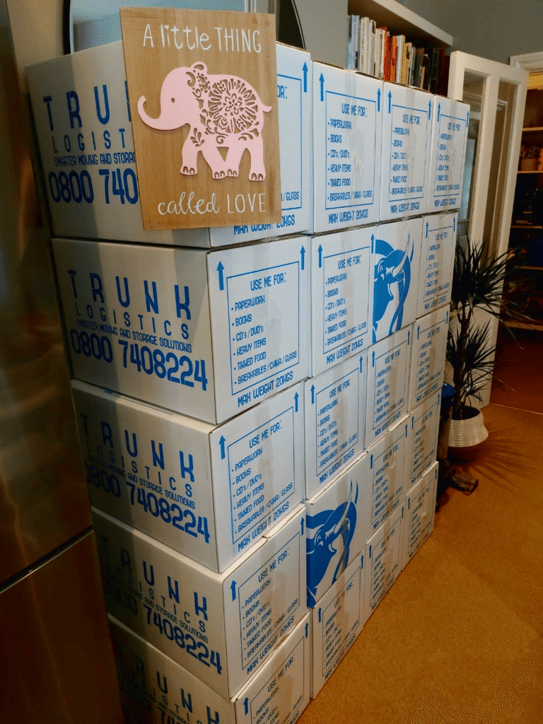 large number of moving boxes packed inside home before removal