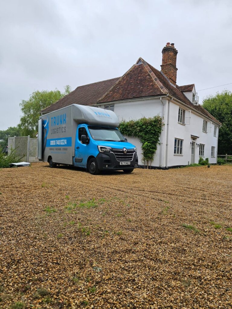 Removals truck outside large countryside home in Hertfordshire during move