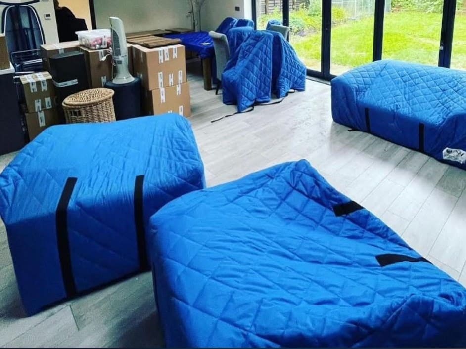Furniture wrapped in protective covers ready for removal by Trunk Logistics