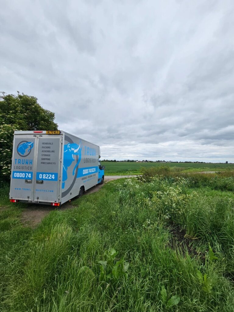 Removals truck on rural road during countryside house move