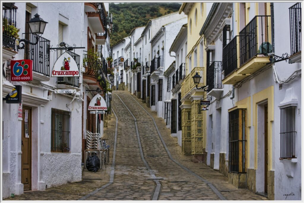 Cobbled street lined with whitewashed buildings in an Andalusian village in southern Spain — UK to Spain removals to Andalusia and rural Spanish addresses by Trunk Logistics