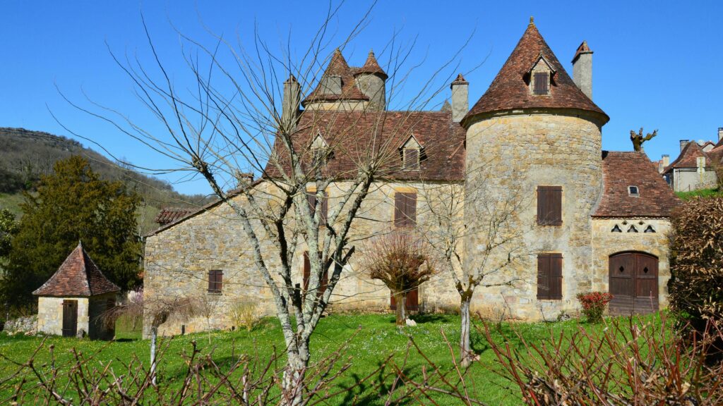 Traditional stone château with turrets in the Dordogne region of France — UK to France removals to the Dordogne and rural southwest French addresses by Trunk Logistics