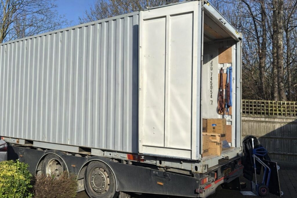 International removals container being loaded for overseas shipping