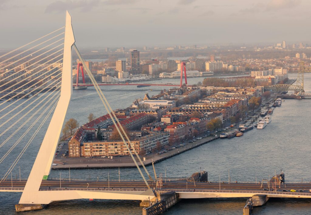 Aerial view of Rotterdam Erasmus Bridge with the Nieuwe Maas river and city skyline — UK to Netherlands removals to Rotterdam by Trunk Logistics