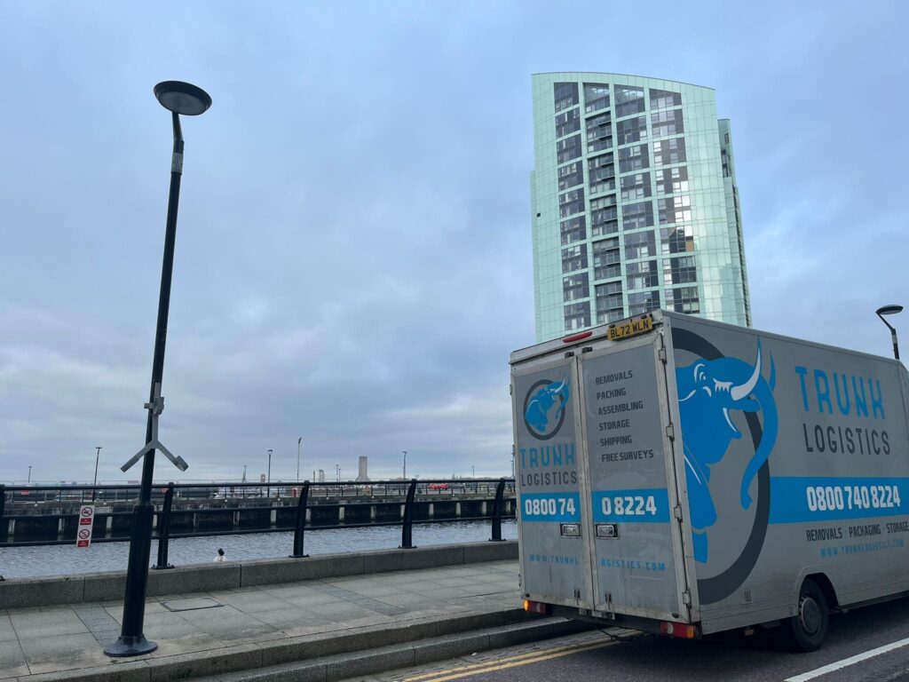 Trunk Logistics removals van parked near Canary Wharf in London during a home removals job