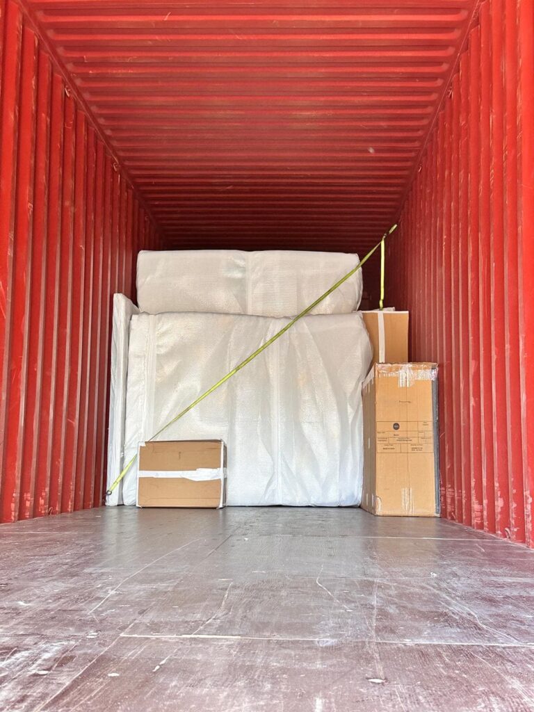 Export packed furniture and boxes secured inside a shipping container for a UK to Dubai household removal
