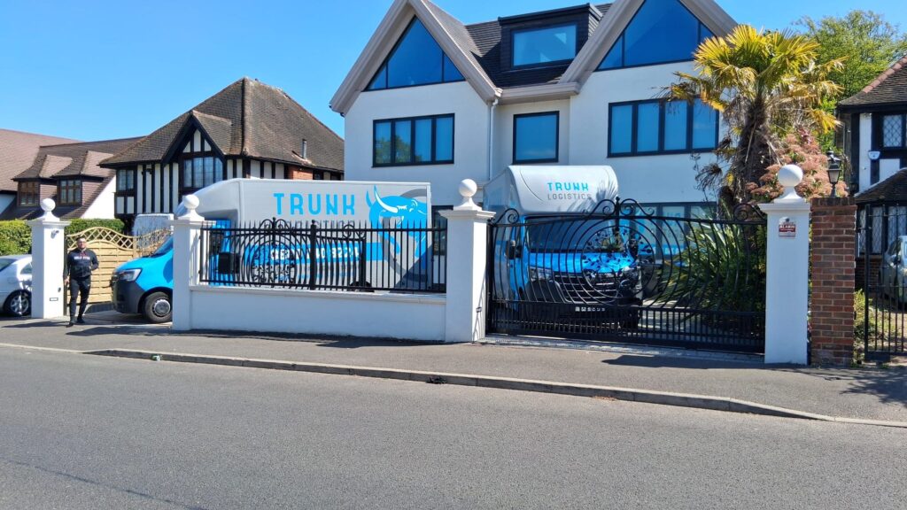 Trunk Logistics removal trucks outside a large residential property in Essex, ready for a home removal
