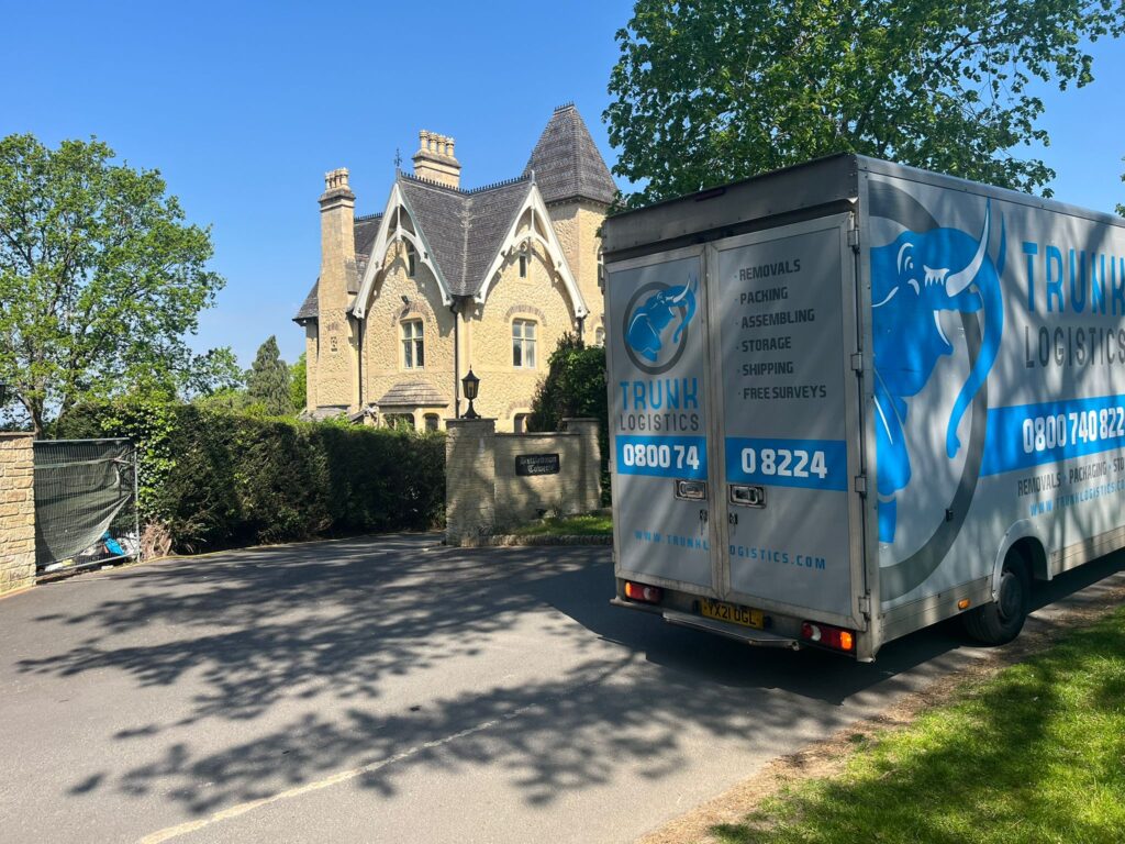 Trunk Logistics removal truck outside a large period property in Cheltenham during a long-distance UK move