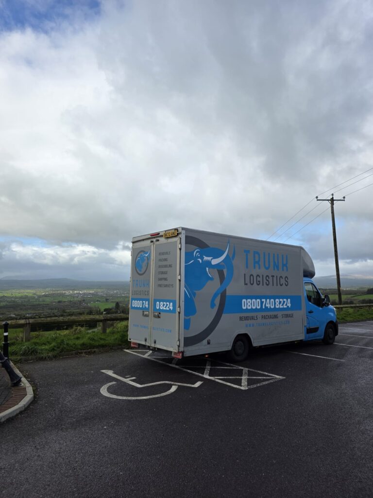 Trunk Logistics removal van at a County Kerry viewpoint overlooking green Kerry countryside — Ireland to UK removals service from County Kerry