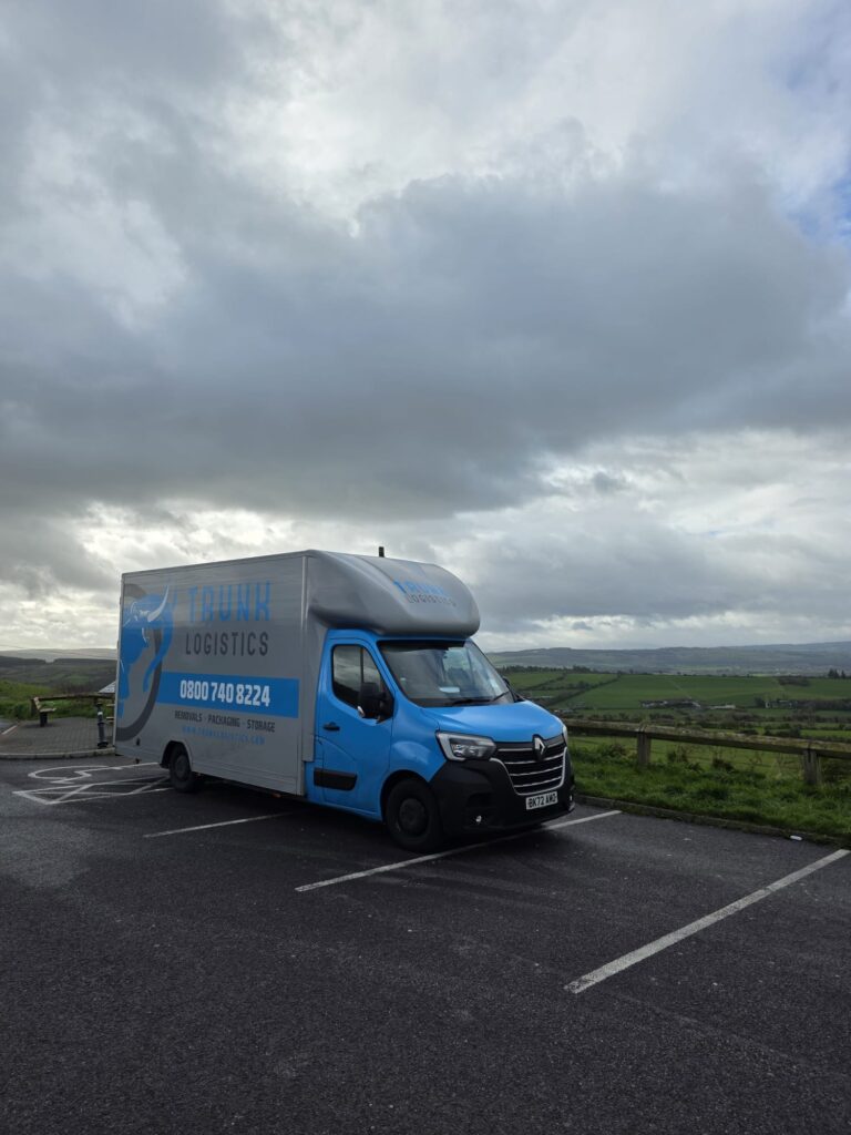 Trunk Logistics removal van at a County Kerry viewpoint with dramatic sky and green Kerry countryside — UK to Ireland and Ireland to UK removal service