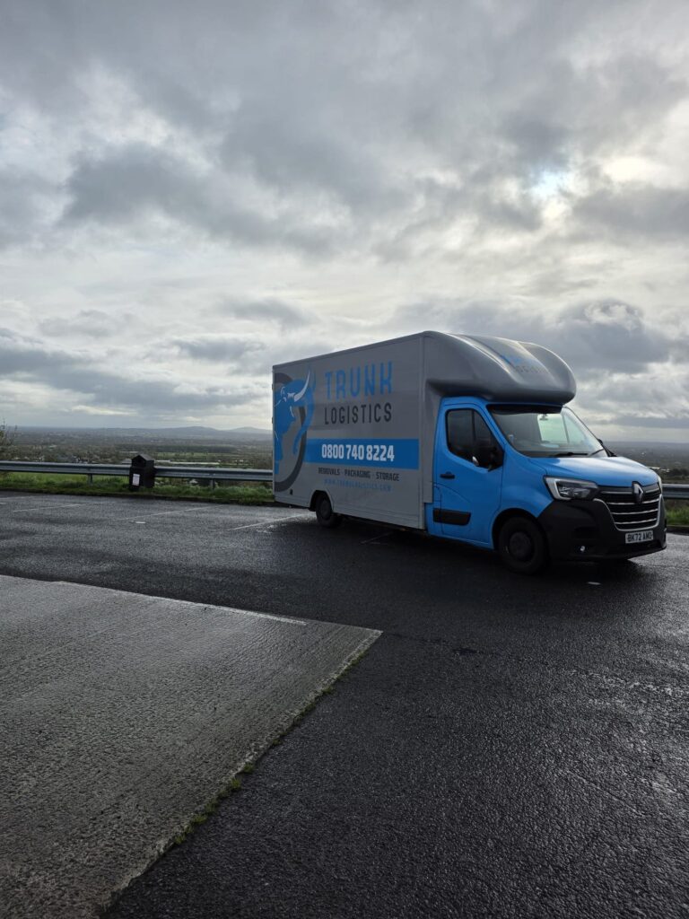 Trunk Logistics removal van at a County Wicklow viewpoint overlooking green Irish countryside — UK to Ireland and Ireland to UK removals service