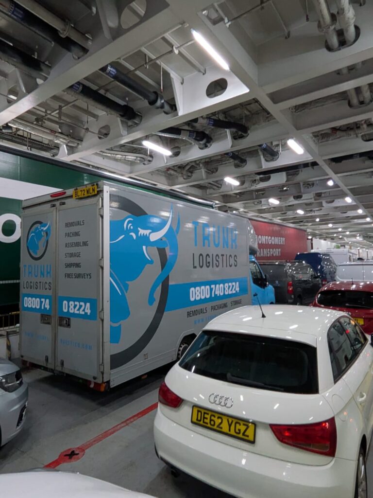 Trunk Logistics removal van loaded on the vehicle deck of the Irish Sea ferry — Ireland to UK removals crossing the Irish Sea on the weekly departure schedule