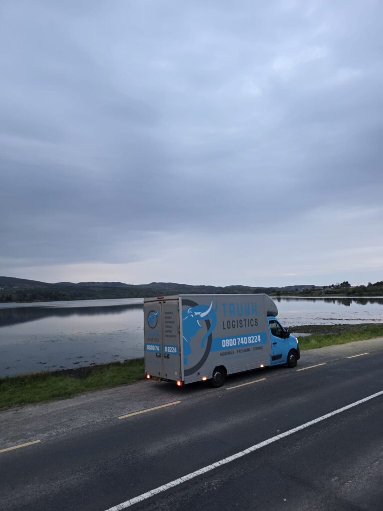 Trunk Logistics removal van on the road beside Mulroy Bay at Kerrykeel, County Donegal — Ireland to UK removals service